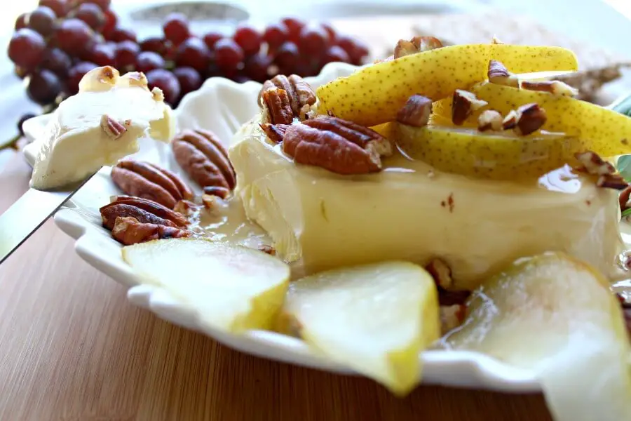 Cream Cheese Appetizer with Poached Pear & Toasted Pecans. A quick & easy recipe that looks and tastes incredible. Your friends & family will be so impressed! Perfect for any occasion | berrysweetlife.com