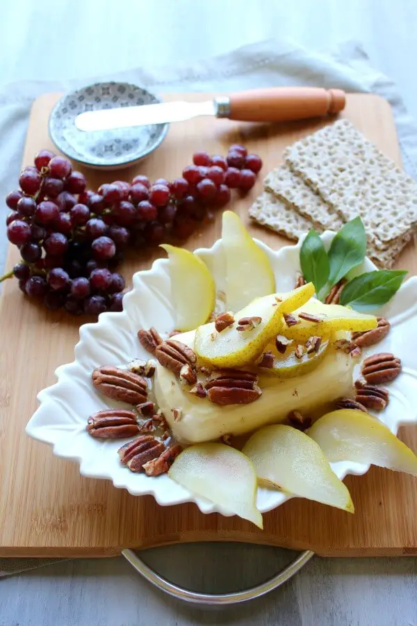 Cream Cheese Appetizer with Poached Pear & Toasted Pecans. A quick & easy recipe that looks and tastes incredible. Your friends & family will be so impressed! Perfect for any occasion | berrysweetlife.com