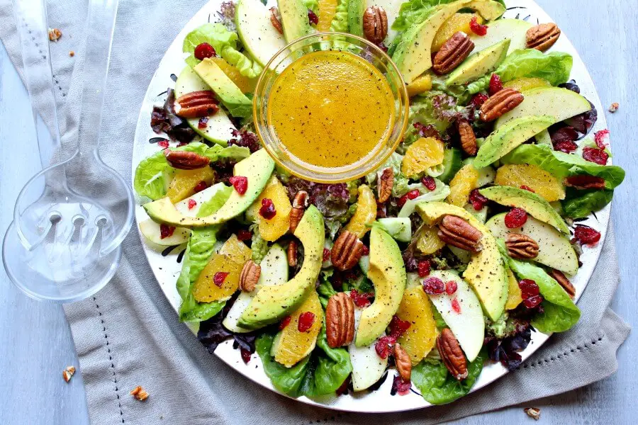 Pecan Cranberry & Avocado Salad with Orange Dressing. A colourful salad recipe perfect for Christmas or any special occasion. Healthy, quick & easy, the perfect side dish | berrysweetlife.com