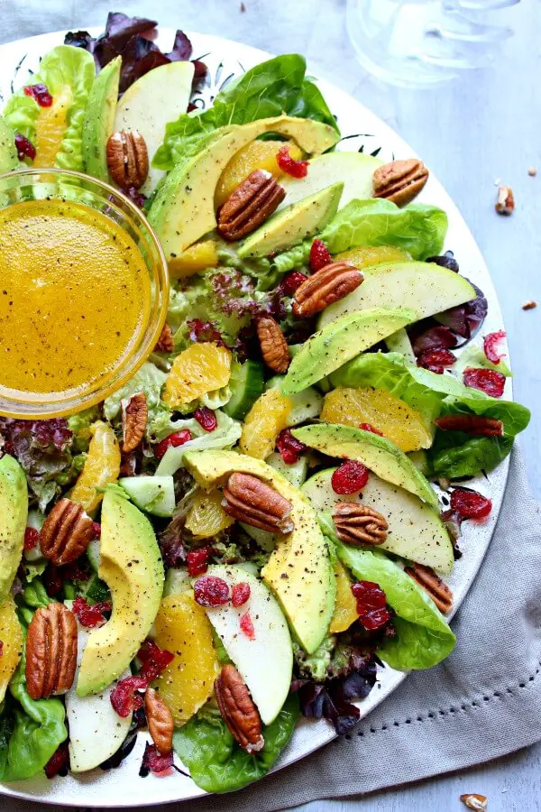 Pecan Cranberry & Avocado Salad with Orange Dressing. A colourful salad recipe perfect for Christmas or any special occasion. Healthy, quick & easy, the perfect side dish | berrysweetlife.com