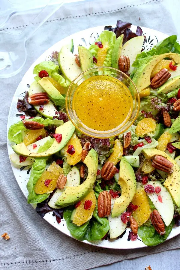 Pecan Cranberry & Avocado Salad with Orange Dressing. A colourful salad recipe perfect for Christmas or any special occasion. Healthy, quick & easy, the perfect side dish | berrysweetlife.com