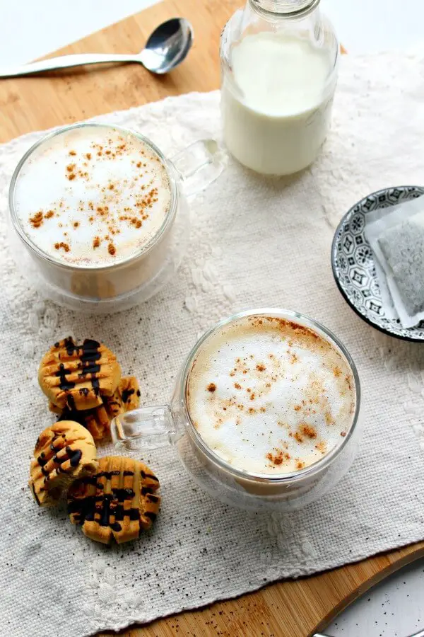 An easy to make hot Earl Grey tea latte with spices, vanilla and frothy milk. This Spiced Vanilla London Fog Latte is sugar free, healthy and so comforting! | berrysweetlife.com