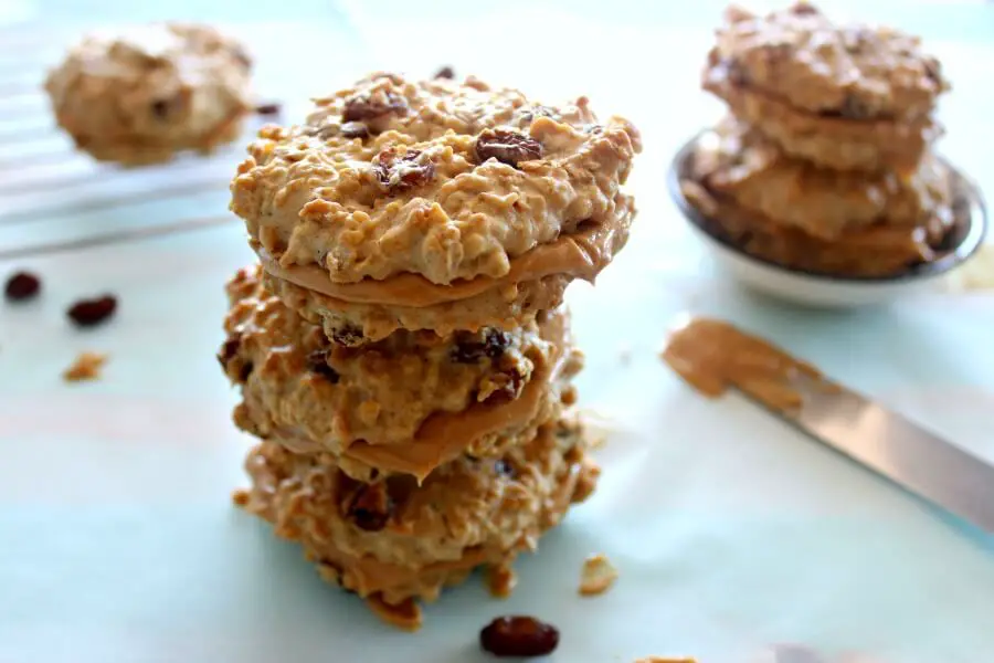 Oaty Raisin Peanut Butter Sandwich Cookies. Healthier oatmeal brown flour & raisin cookies with a peanut butter filling. A delicious snack or tea time treat. Your kids will love these! | berrysweetlife.com