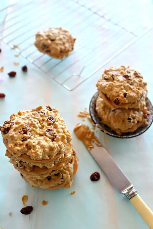 Oaty Raisin Peanut Butter Sandwich Cookies. Healthier oatmeal brown flour & raisin cookies with a peanut butter filling. A delicious snack or tea time treat. Your kids will love these! | berrysweetlife.com