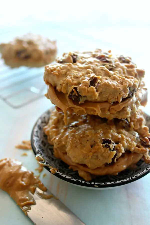 Oaty Raisin Peanut Butter Sandwich Cookies. Healthier oatmeal brown flour & raisin cookies with a peanut butter filling. A delicious snack or tea time treat. Your kids will love these! | berrysweetlife.com