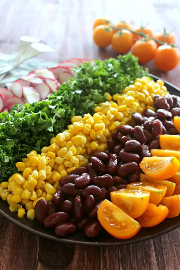 Mexican Chopped Corn, Vine Tomato & Kale Salad. A simple & tasty recipe with a Lemon & Honey Olive Oil Dressing. Perfect for a light lunch or as a side salad. The whole family will love this! | berrysweetlife.com