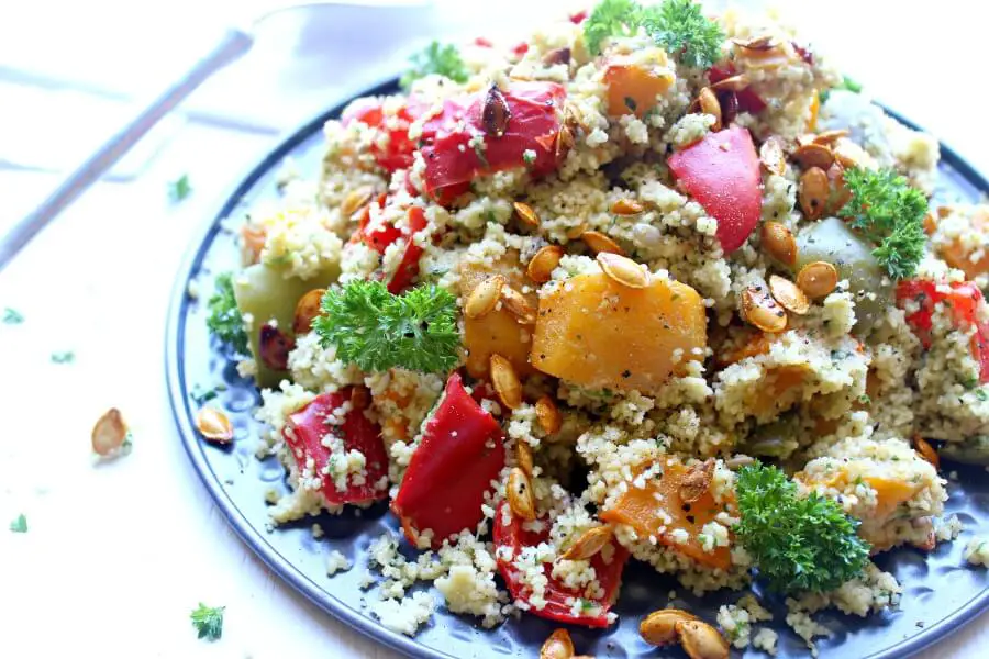 Roasted Butternut Squash Cous Cous Salad with Pesto Dressing. An easy, healthy vegetarian salad that is bursting with colour and flavour. You can't go wrong with this healthy dish! | berrysweetlife.com