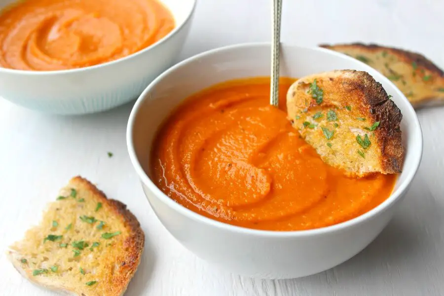 Cozy Up Tomato & Butternut Squash Soup. The perfect soup for a cozy night in! It's a quick & easy recipe packed with flavour that everyone will enjoy | berrysweetlife.com