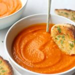 Cozy Up Tomato & Butternut Squash Soup. The perfect soup for a cozy night in! It's a quick & easy recipe packed with flavour that everyone will enjoy | berrysweetlife.com