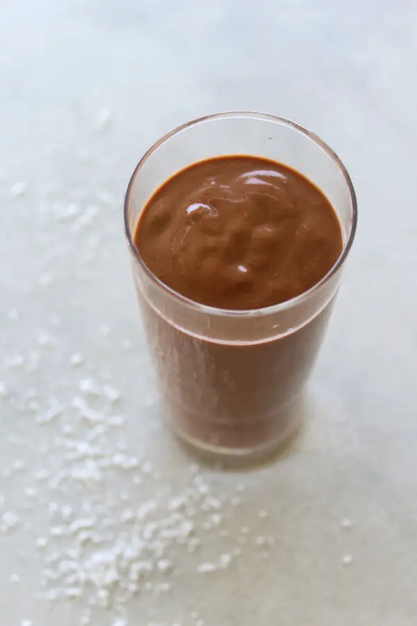 A super chocolatey, thick and creamy, healthy Chocolate Cinnamon Coconut Smoothie made with cocoa powder, bananas, dates, coconut milk. Dairy free, vegan | berrysweetlife.com