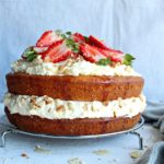 Zesty Orange Honey Layer Cake. The moistest, most tasty orange sponge cake with whipped cream & chopped almond layers & fresh strawberries on top. AMAZING! | berrysweetlife.com