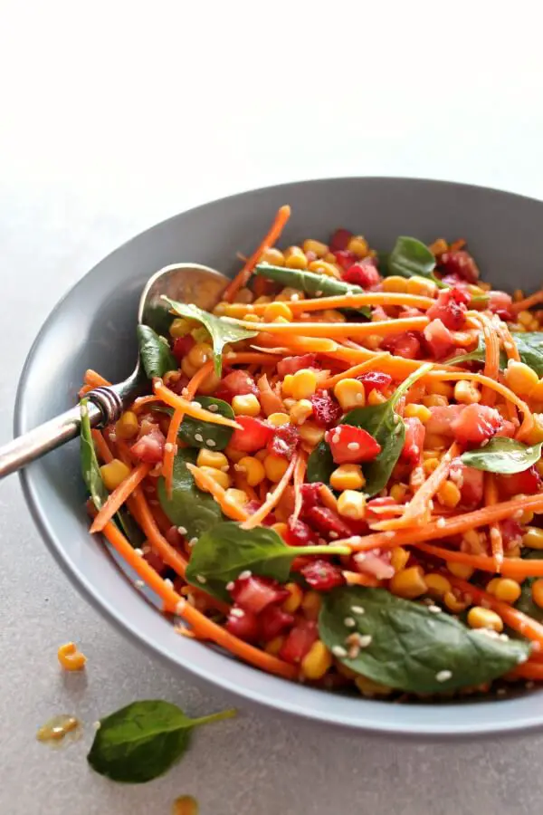 Asian Carrot Salad with Peanut Ginger Dressing. A crunchy, flavourful salad with a smooth, peanut dressing. The perfect light, healthy meal or delicious side dish for any occasion | berrysweetlife.com