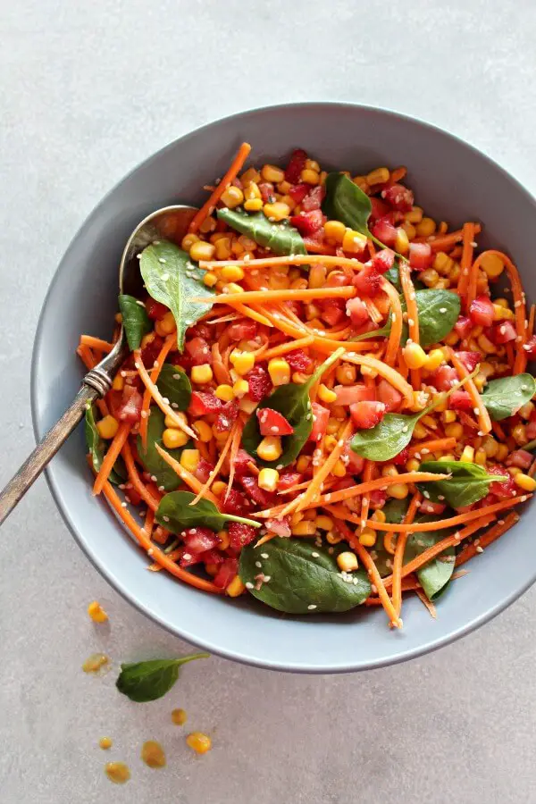 Asian Carrot Salad with Peanut Ginger Dressing. A crunchy, flavourful salad with a smooth, peanut dressing. The perfect light, healthy meal or delicious side dish for any occasion | berrysweetlife.com