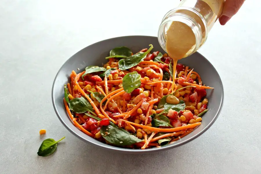 Asian Carrot Salad with Peanut Ginger Dressing. A crunchy, flavourful salad with a smooth, peanut dressing. The perfect light, healthy meal or delicious side dish for any occasion | berrysweetlife.com