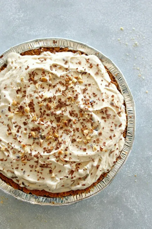 Chocolate Chip Peanut Butter Ice Cream Pie. An easy dessert and HEAVENLY Indulgence! Made with a tub of vanilla ice cream, nut butter, chocolate chips and a graham cracker crust, perfect for summer get togethers! | berrysweetlife.com