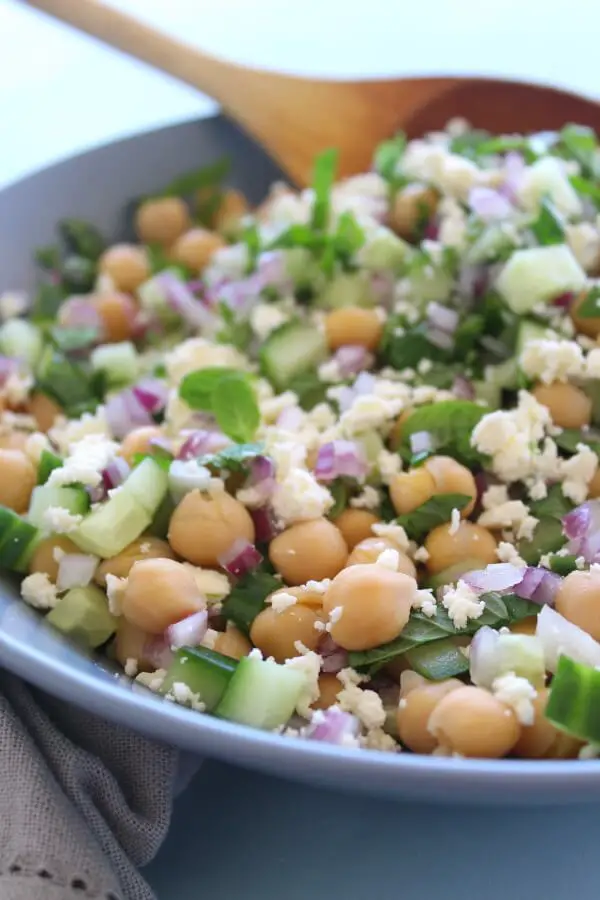 A heavenly combination! This easy Clean Eating Cucumber Mint Chickpea Salad salad is made with cucumber, mint, chickpeas, red onion, feta and almonds | berrysweetlife.com