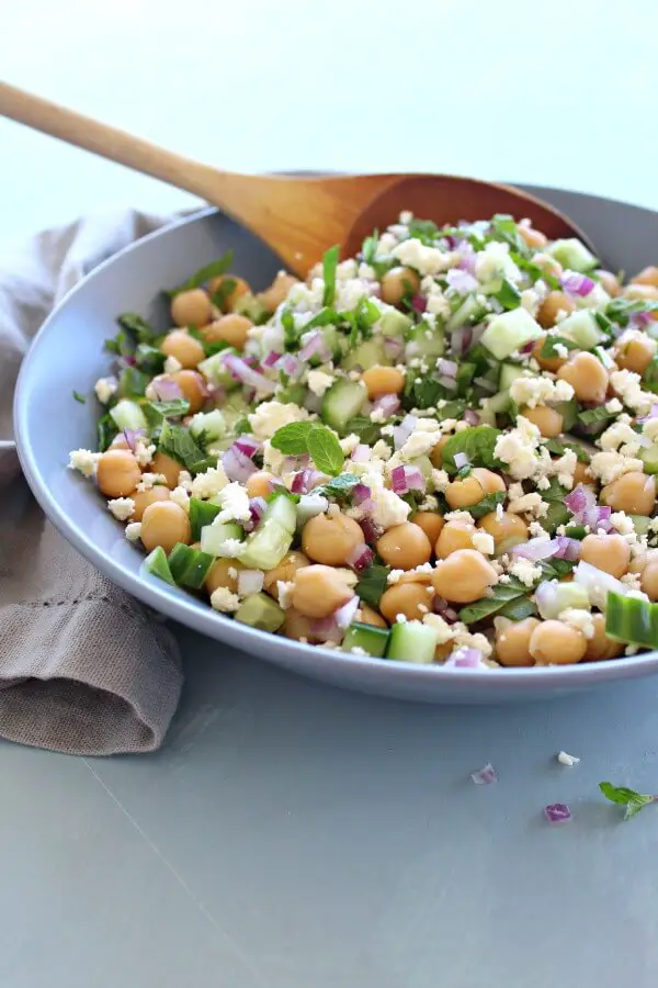 A heavenly combination! This easy Clean Eating Cucumber Mint Chickpea Salad salad is made with cucumber, mint, chickpeas, red onion, feta and almonds | berrysweetlife.com