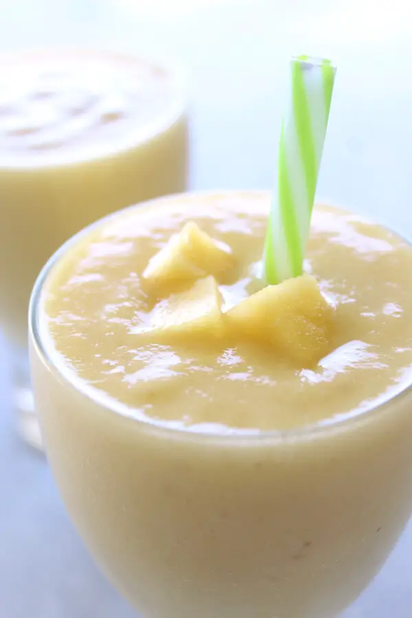 Delicious, healthy, creamy pineapple fruit smoothie made with or without yoghurt. Have a tropical island breakfast with this Pina Colada Pineapple Smoothie! | berrysweetlife.com