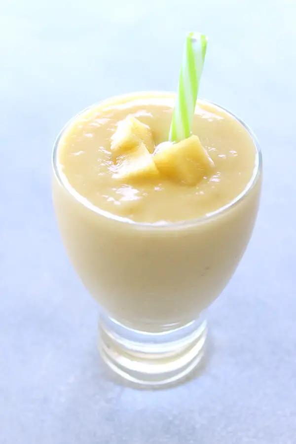 Delicious, healthy, creamy pineapple fruit smoothie made with or without yoghurt. Have a tropical island breakfast with this Pina Colada Pineapple Smoothie! | berrysweetlife.com