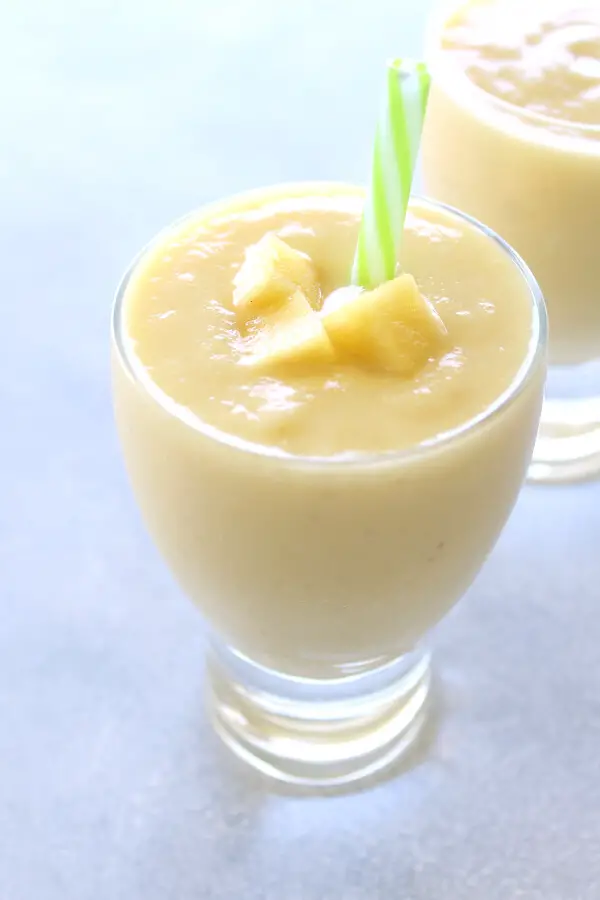 Delicious, healthy, creamy pineapple fruit smoothie made with or without yoghurt. Have a tropical island breakfast with this Pina Colada Pineapple Smoothie! | berrysweetlife.com