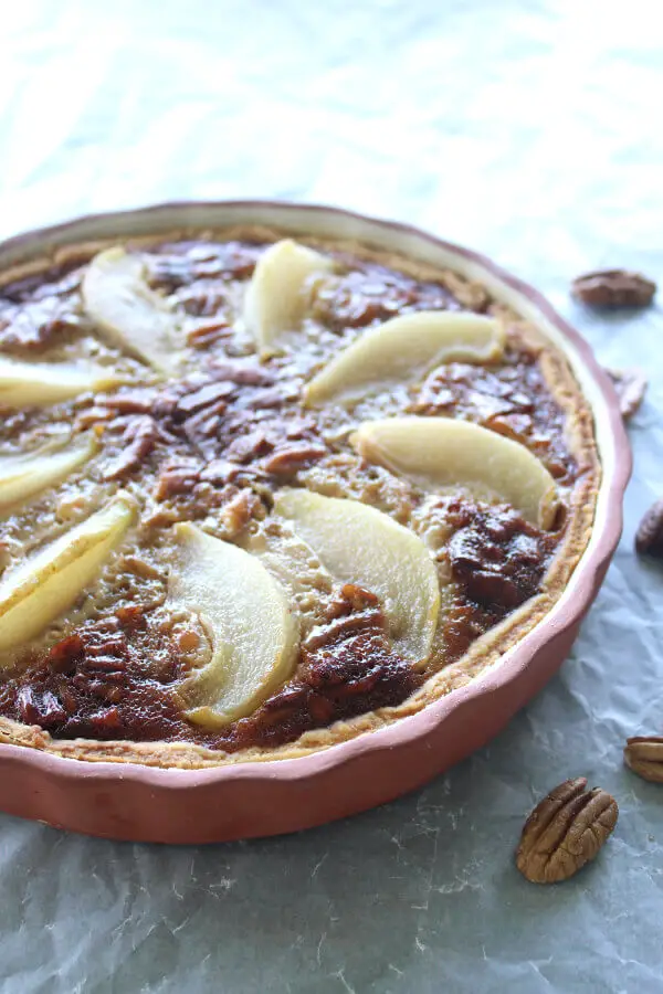 A Rich Caramel Pecan Pear Pie recipe that is the best I have ever had! Made with a buttery crust from scratch, poached pears and a creamy caramel filling | berrysweetlife.com