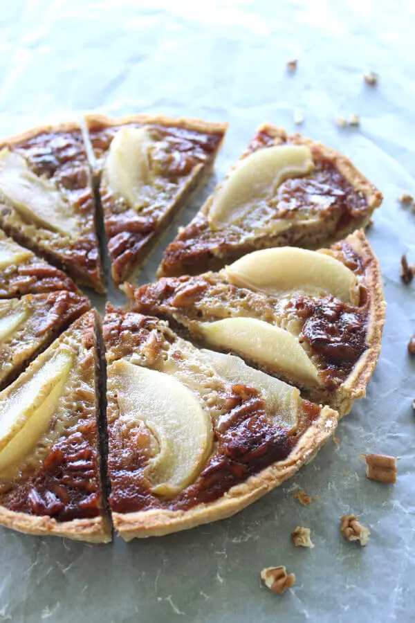 A Rich Caramel Pecan Pear Pie recipe that is the best I have ever had! Made with a buttery crust from scratch, poached pears and a creamy caramel filling | berrysweetlife.com