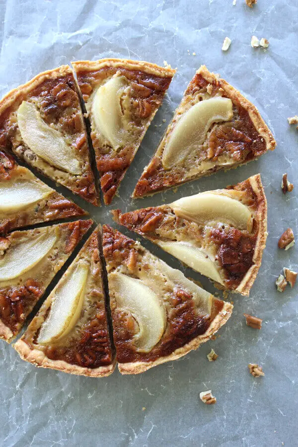 A Rich Caramel Pecan Pear Pie recipe that is the best I have ever had! Made with a buttery crust from scratch, poached pears and a creamy caramel filling | berrysweetlife.com