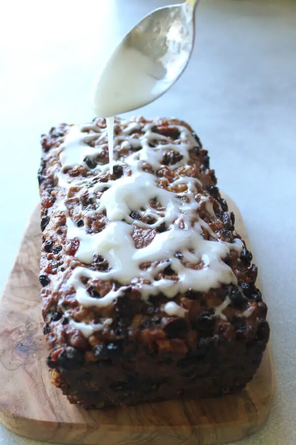 Moist, easy to make fruit and nut loaf recipe with a twist! This Walnut Fruit Loaf With Lemon Icing is the best combination of flavours, enjoy a slice with a cup of tea or coffee! | berrysweetlife.com