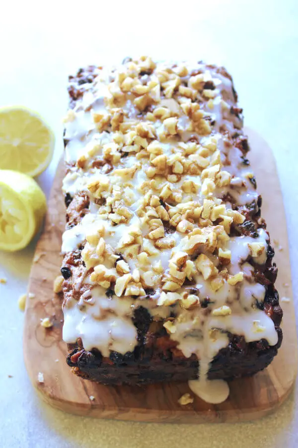 Moist, easy to make fruit and nut loaf recipe with a twist! This Walnut Fruit Loaf With Lemon Icing is the best combination of flavours, enjoy a slice with a cup of tea or coffee! | berrysweetlife.com