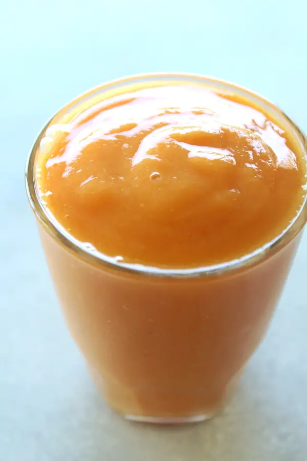 A vegan, easy to make Nourishing Mango Papaya Ginger Smoothie made with just 4 ingredients and your blender in 5 minutes! It tastes wonderful, is silky smooth, overflowing with healthy goodness | berrysweetlife.com