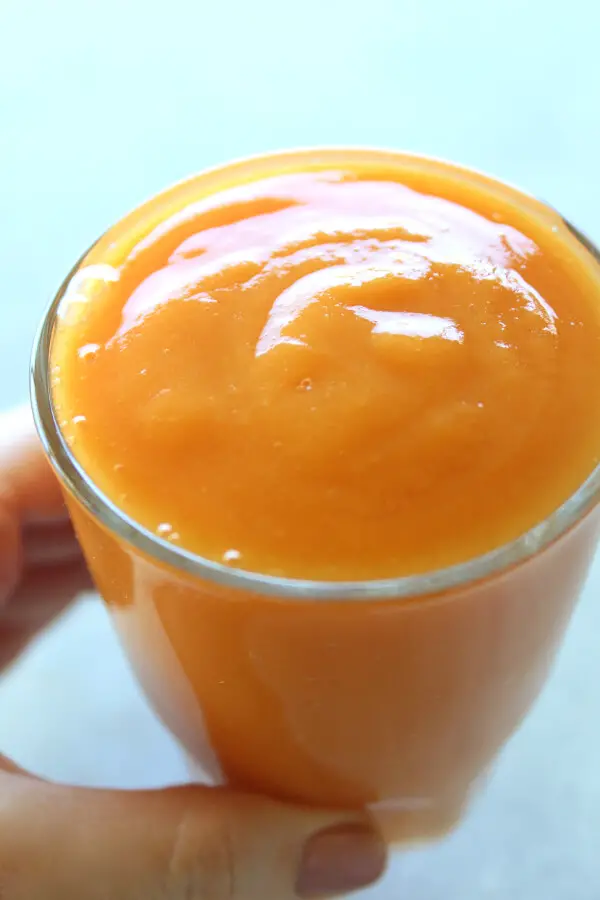 A vegan, easy to make Nourishing Mango Papaya Ginger Smoothie made with just 4 ingredients and your blender in 5 minutes! It tastes wonderful, is silky smooth, overflowing with healthy goodness | berrysweetlife.com