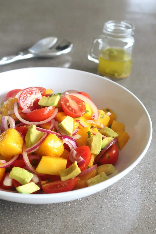 Refreshing, tasty Summer Fiesta Mango Avocado Red Onion Salad! Easy to prepare, vegan, raw, low carb and packed full of healthy goodness! | berrysweetlife.com