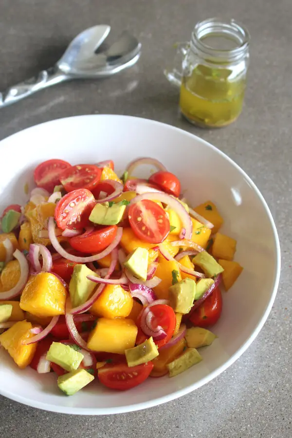 Refreshing, tasty Summer Fiesta Mango Avocado Red Onion Salad! Easy to prepare, vegan, raw, low carb and packed full of healthy goodness! | berrysweetlife.com