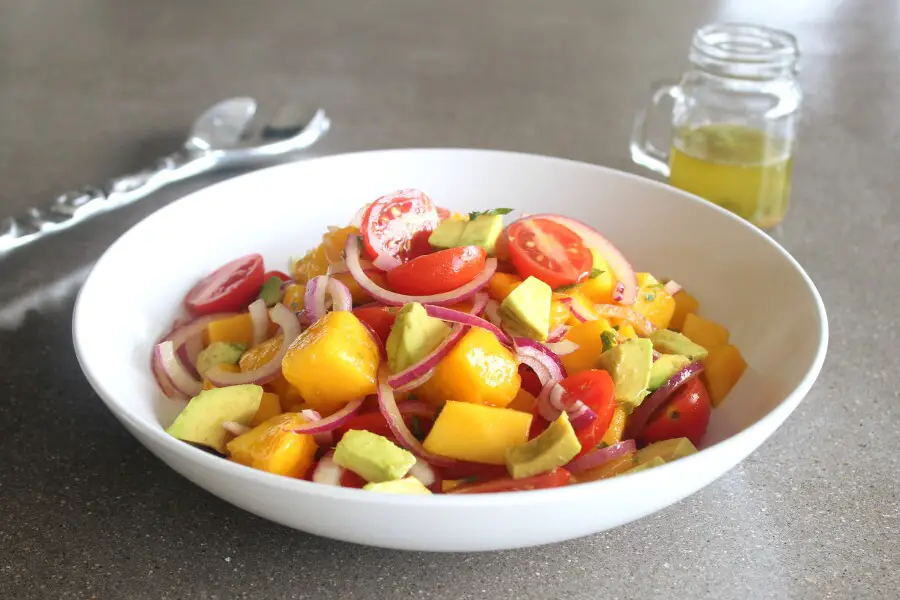 Refreshing, tasty Summer Fiesta Mango Avocado Red Onion Salad! Easy to prepare, vegan, raw, low carb and packed full of healthy goodness! | berrysweetlife.com