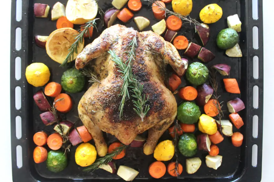 Healthy Lemon Herb Roast Chicken And Veggies recipe delivers crispy skin, juicy, tender and tasty meat with wonderful lemon, rosemary and garlic flavours! | berrysweetlife.com