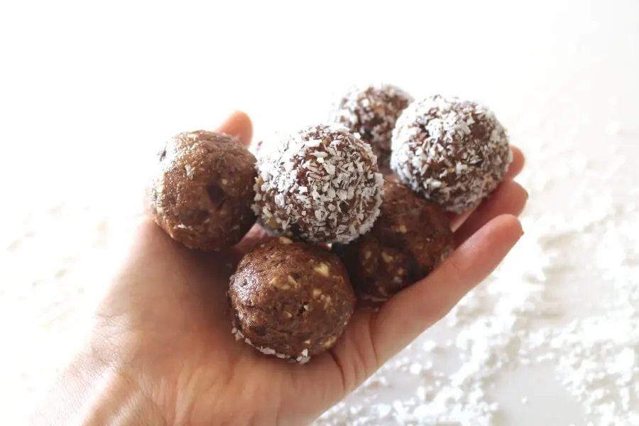 Melt in your mouth smooth, creamy, nutty, sweet and chocolatey! Cacao Coconut Date Bliss Balls are like dessert, yet are a healthy and easy to make snack! | berrysweetlife.com