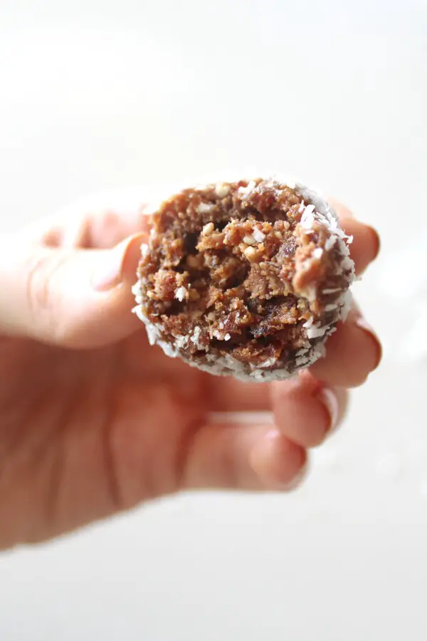 Melt in your mouth smooth, creamy, nutty, sweet and chocolatey! Cacao Coconut Date Bliss Balls are like dessert, yet are a healthy and easy to make snack! | berrysweetlife.com